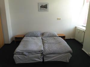 Postel nebo postele na pokoji v ubytování Pension na hranici