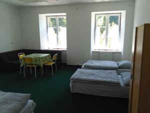 Postel nebo postele na pokoji v ubytování Pension na hranici