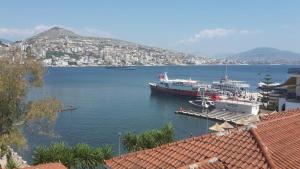 a large boat is docked in a large body of water at Saranda Backpackers in Sarandë