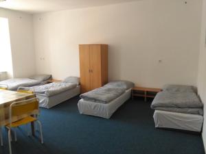 Postel nebo postele na pokoji v ubytování Pension na hranici