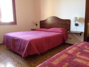 Ein Bett oder Betten in einem Zimmer der Unterkunft Holiday Home Recanati