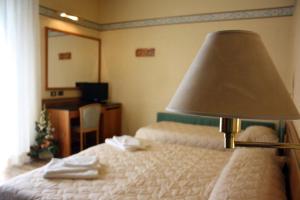 Postel nebo postele na pokoji v ubytování Hotel Marina Bay