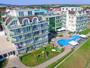 an aerial view of a large building with a swimming pool at Alexander Lozenets Beach Complex Apartment in Lozenets