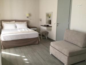 Ένα ή περισσότερα κρεβάτια σε δωμάτιο στο Kochyli Hotel