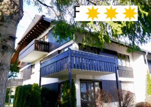 a building with blue and yellow stars on it at Ferienwohnung Hochfirstblick in Titisee-Neustadt