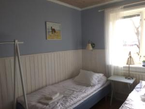 Säng eller sängar i ett rum på Karaby Gård
