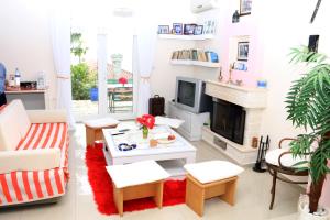 a living room with a couch and a fireplace at Holiday Home Ali in Piqeras