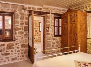 Postel nebo postele na pokoji v ubytování Helios Garden Boutique Apartments