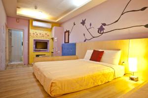 Krevet ili kreveti u jedinici u okviru objekta Bashi Channel Vacation B&B
