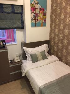 Katil atau katil-katil dalam bilik di Seasons Hotel - Causeway Bay