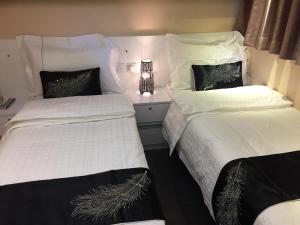 Katil atau katil-katil dalam bilik di Seasons Hotel - Causeway Bay