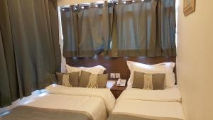 Katil atau katil-katil dalam bilik di Seasons Hotel - Causeway Bay