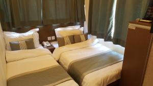 Katil atau katil-katil dalam bilik di Seasons Hotel - Causeway Bay