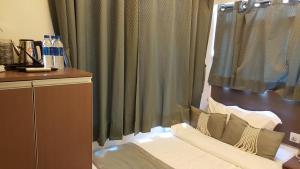 Katil atau katil-katil dalam bilik di Seasons Hotel - Causeway Bay