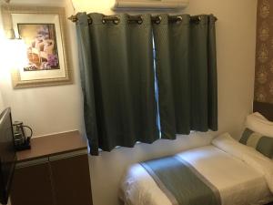 Katil atau katil-katil dalam bilik di Seasons Hotel - Causeway Bay