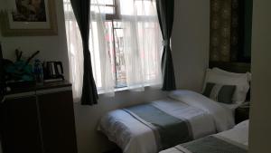 Katil atau katil-katil dalam bilik di Seasons Hotel - Causeway Bay