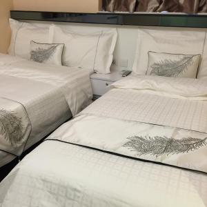 Katil atau katil-katil dalam bilik di Seasons Hotel - Causeway Bay