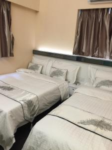 Katil atau katil-katil dalam bilik di Seasons Hotel - Causeway Bay