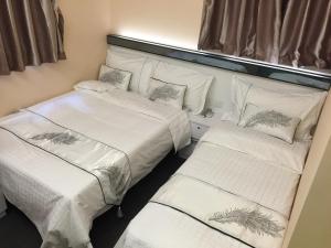 Katil atau katil-katil dalam bilik di Seasons Hotel - Causeway Bay