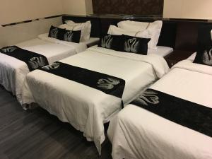 Katil atau katil-katil dalam bilik di Seasons Hotel - Causeway Bay