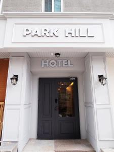 a park hill hotel sign over the door of a building at Hotel Park Hill Myeongdong in Seoul