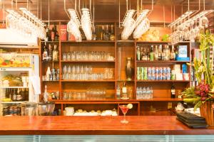 a bar with a wine glass on a counter at Vien Dong Hotel 2 in Ho Chi Minh City