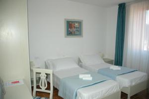 Voodi või voodid majutusasutuse Albergo Dei 10 Colori toas