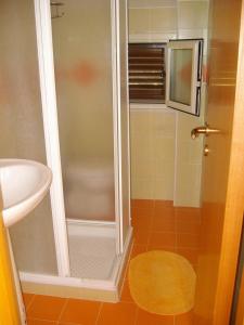 a bathroom with a shower and a sink at Villa Giorgia in Noto Marina