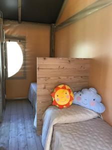 Ein Bett oder Betten in einem Zimmer der Unterkunft New Camping Le Tamerici