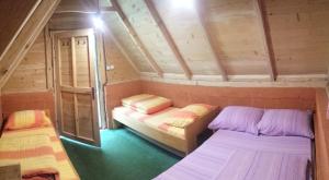 A bed or beds in a room at Camping Drina