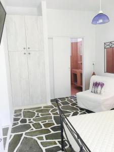 Postel nebo postele na pokoji v ubytování Onar studios & residences