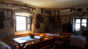 a dining room with wooden tables and a window at Apartment Kalikut in Beli