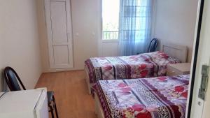 Letto o letti in una camera di Mari Guest House