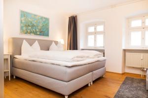 Ein Bett oder Betten in einem Zimmer der Unterkunft KulturQuartier