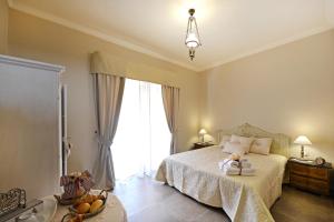 Una cama o camas en una habitación de B&B A Casa di Nonna Giovanna