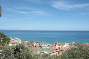 a view of a town with the ocean in the background at Poggio del sole in Laigueglia