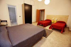 Letto o letti in una camera di Dimora Hostel