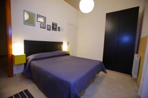 Letto o letti in una camera di Dimora Hostel