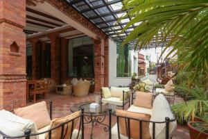 Uma área de estar em Dahlia Boutique Hotel