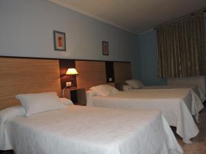 A bed or beds in a room at Cruceiro do Monte