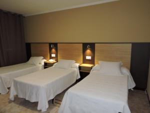 A bed or beds in a room at Cruceiro do Monte
