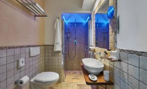 a bathroom with a shower and a toilet and a sink at Hotel Rocca Della Sena in Tropea +53 photos