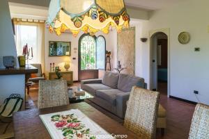 a living room with a couch and a table at Villa Tina in Taormina