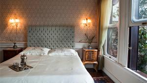 Cama ou camas em um quarto em Kitapevi Hotel