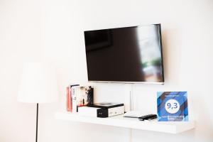 Televízia a/alebo spoločenská miestnosť v ubytovaní 3D Royal Castle Apartament