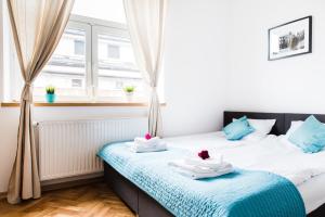 Posteľ alebo postele v izbe v ubytovaní 3D Royal Castle Apartament