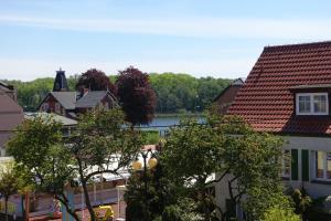 a view of a town with a river and houses at Przy Mickiewicza in Dziwnów