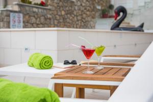 a table with two glasses on top of a boat at Villa Boro in Dubrovnik