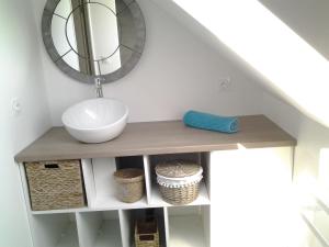 a bathroom with a sink and a mirror at L'Olivier de munet in Distré +24 photos