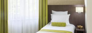 Postel nebo postele na pokoji v ubytování Hotel Alex